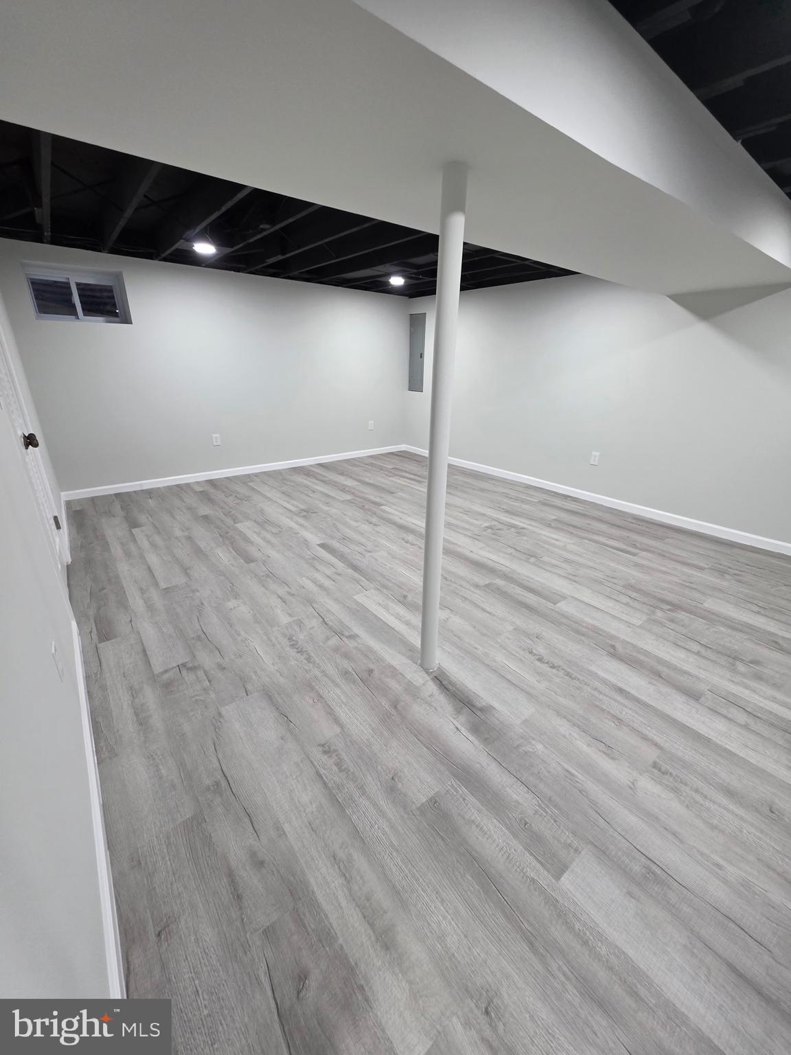 7005 Nightingale Terrace Lanham, MD 20706 - Photo 18 of 23 a view of empty room with wooden floor