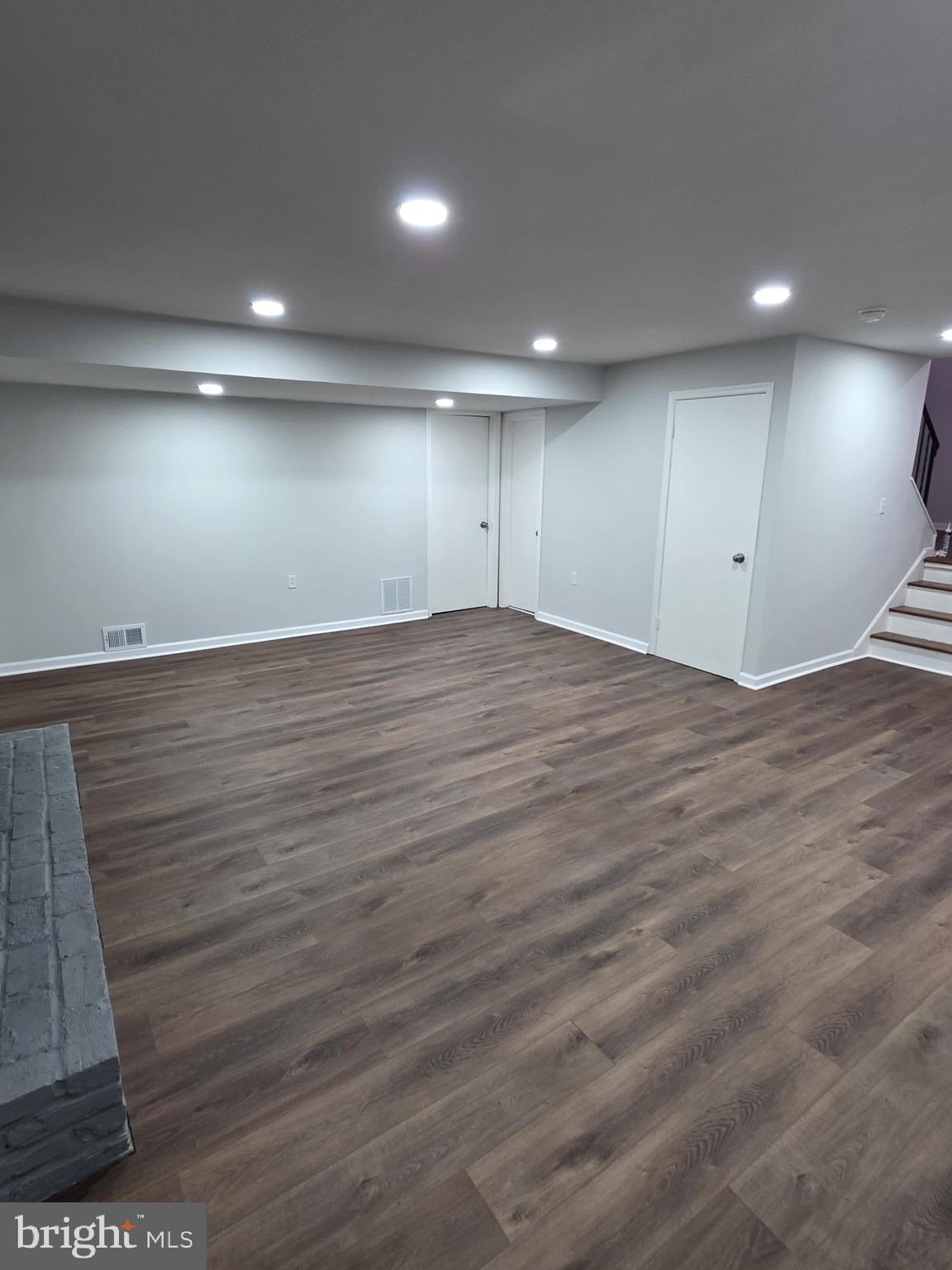 7005 Nightingale Terrace Lanham, MD 20706 - Photo 19 of 23 an empty room with wooden floor and windows