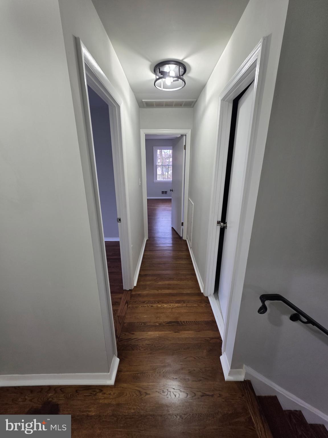 7005 Nightingale Terrace Lanham, MD 20706 - Photo 21 of 23 a view of a hallway with wooden floor and staircase