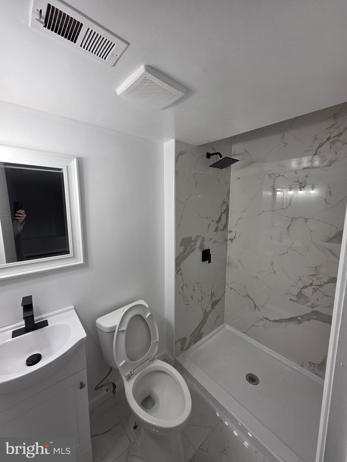 7005 Nightingale Terrace Lanham, MD 20706 - Photo 5 of 23 a bathroom with a sink a toilet and shower