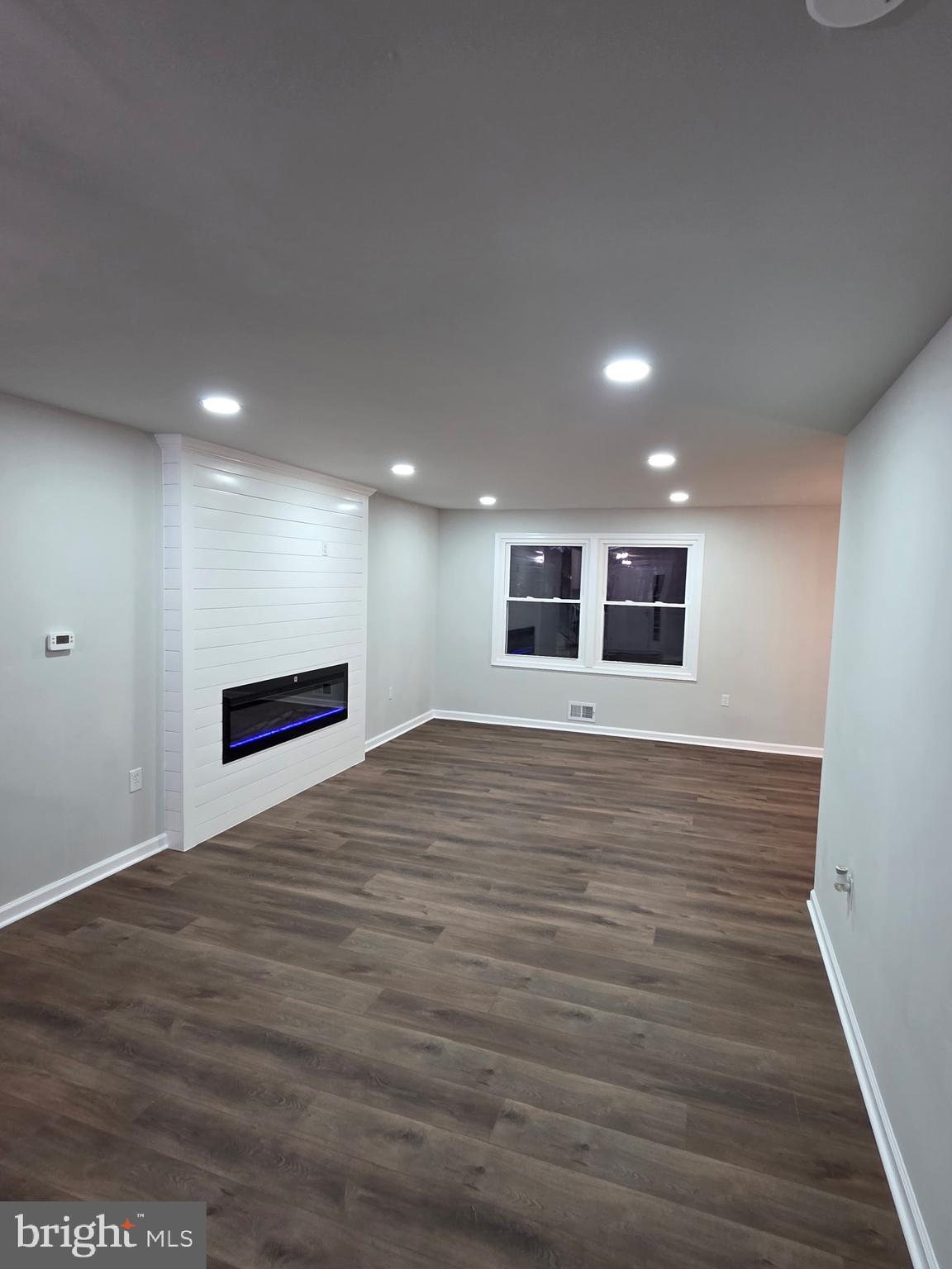 7005 Nightingale Terrace Lanham, MD 20706 - Photo 7 of 23 a view of an empty room with wooden floor