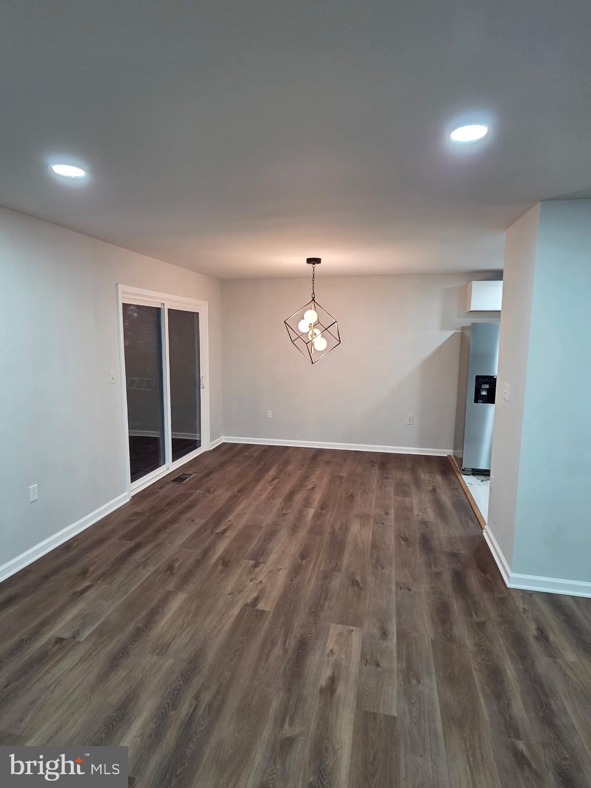 7005 Nightingale Terrace Lanham, MD 20706 - Photo 8 of 23 a view of empty room with wooden floor and fan