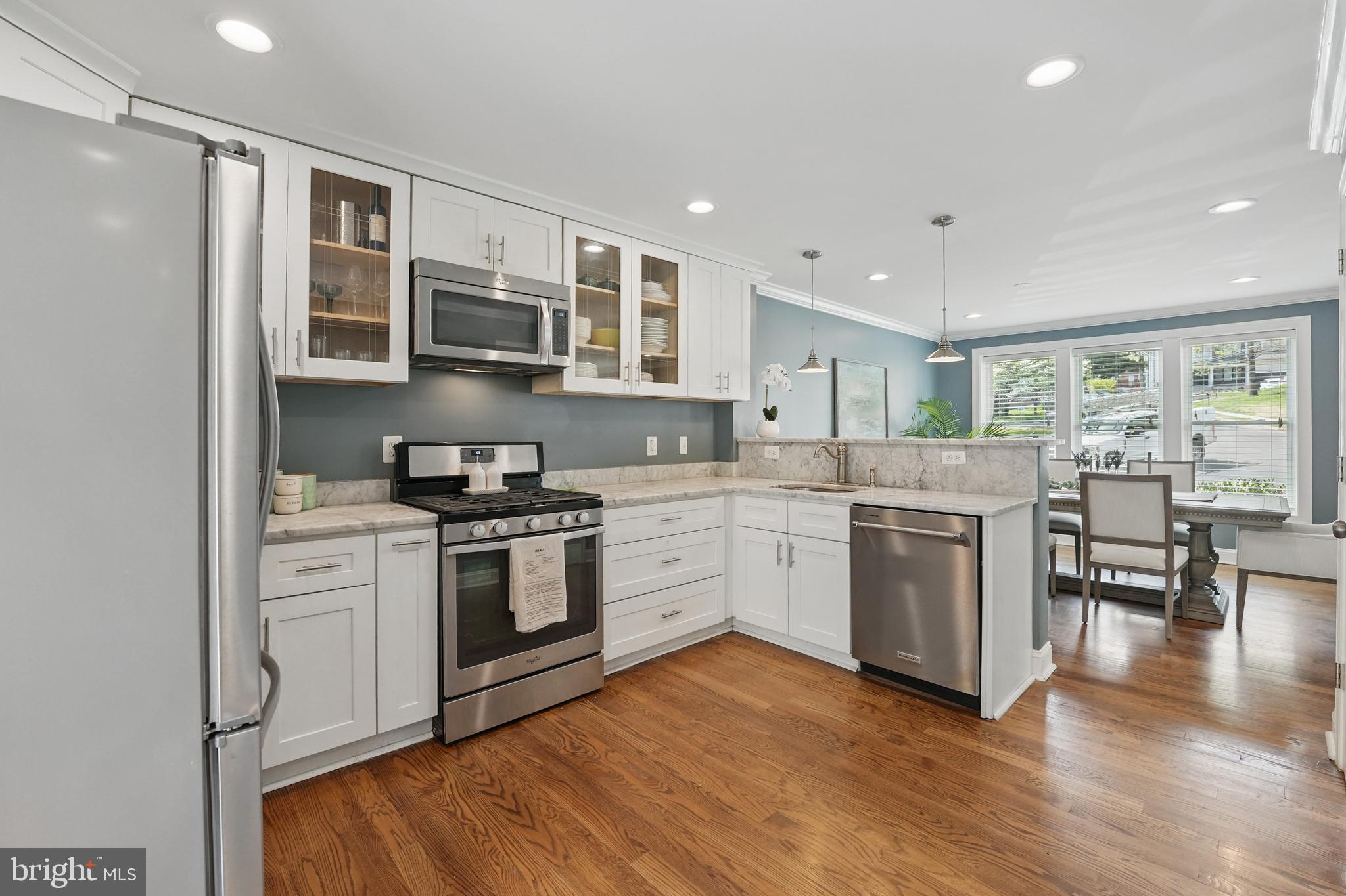 6930 27th Road North Arlington, VA 22213 - Photo 15 of 51 a kitchen with a stove top oven sink and cabinets