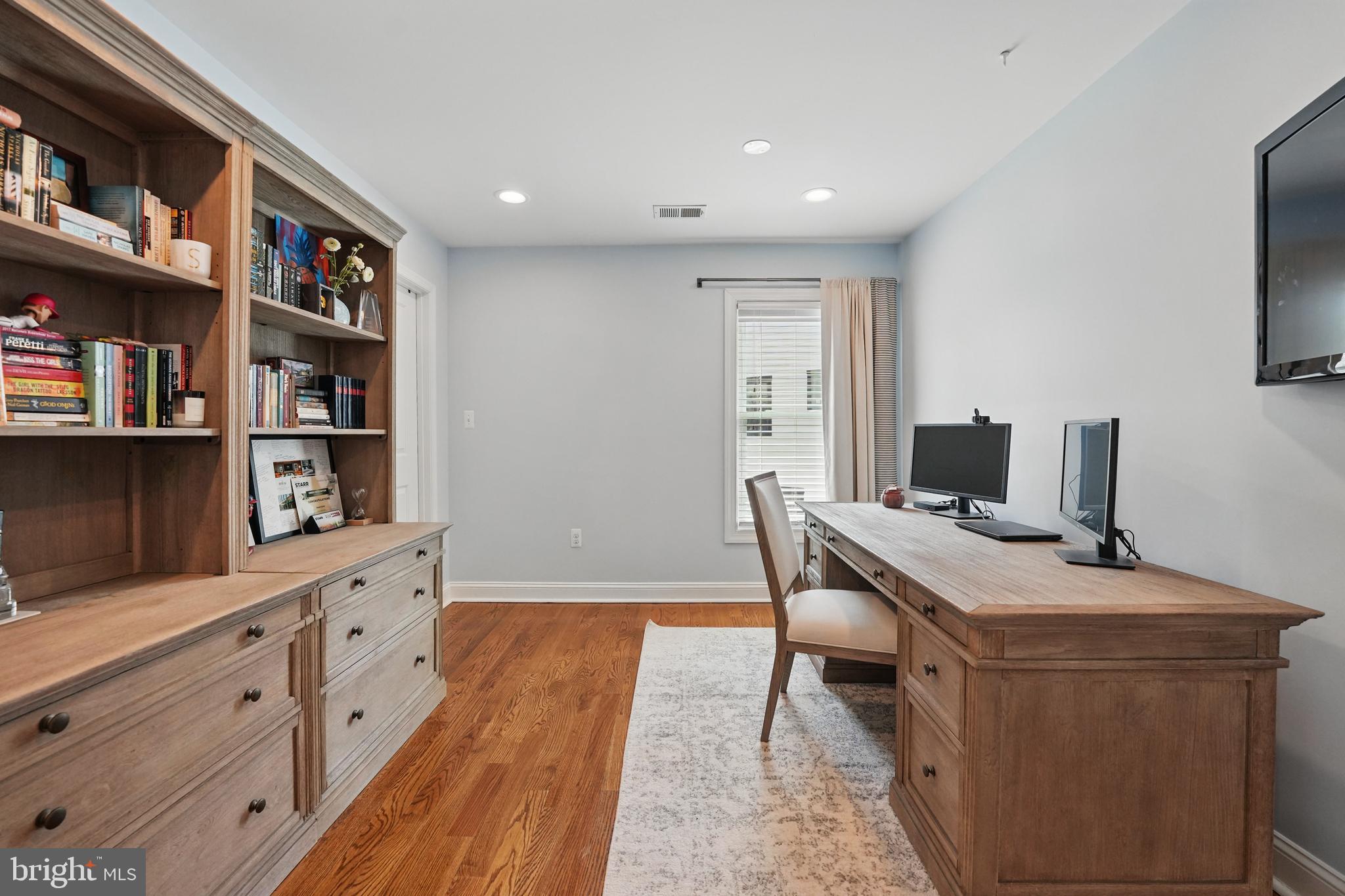 6930 27th Road North Arlington, VA 22213 - Photo 28 of 51 a workspace with furniture and bookshelf