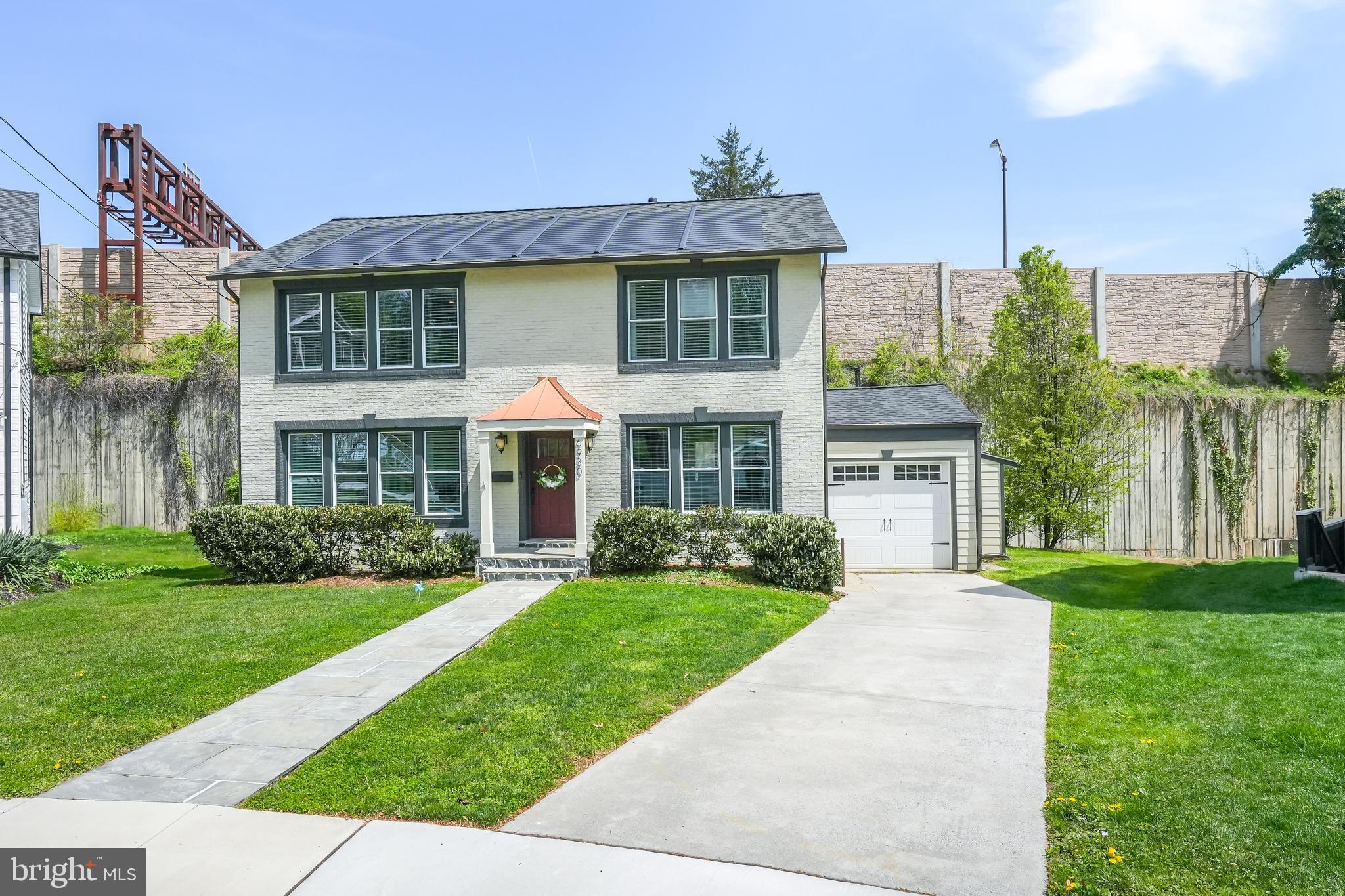 6930 27th Road North Arlington, VA 22213 - Photo 3 of 51 a front view of a house with a yard