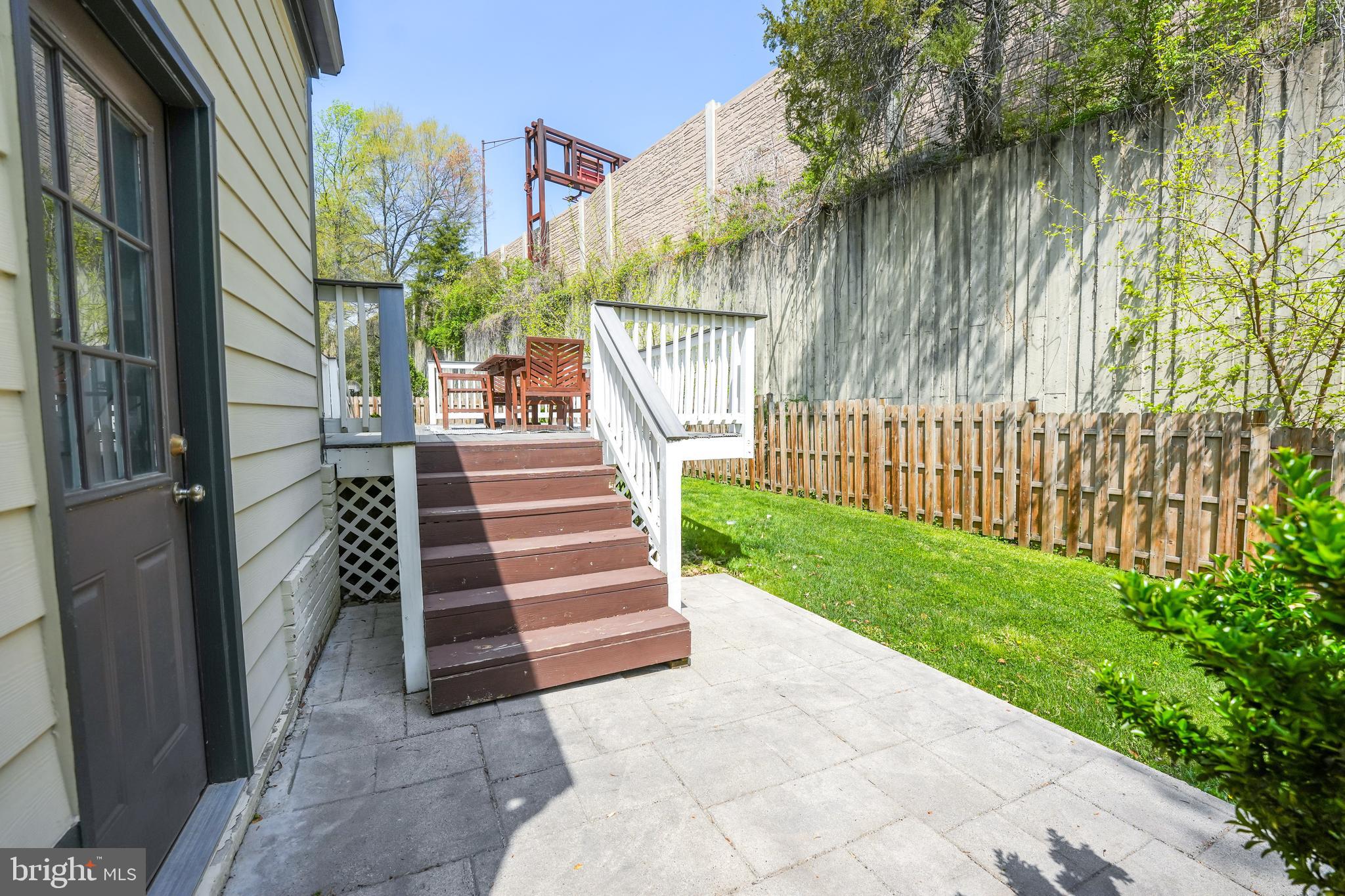 6930 27th Road North Arlington, VA 22213 - Photo 42 of 51 a view of a yard with large tree and wooden fence