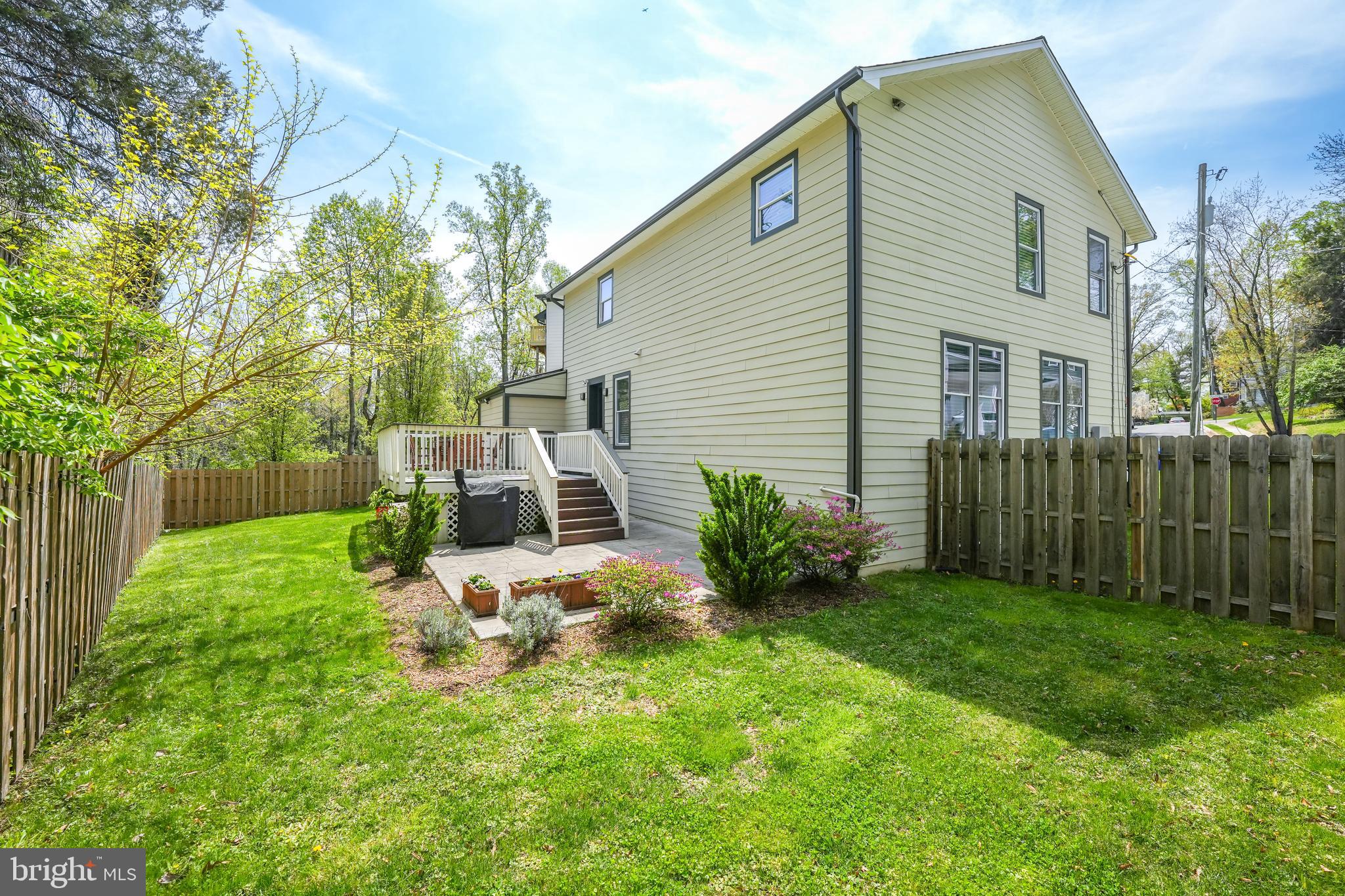 6930 27th Road North Arlington, VA 22213 - Photo 47 of 51 a view of backyard of house with wooden deck and seating