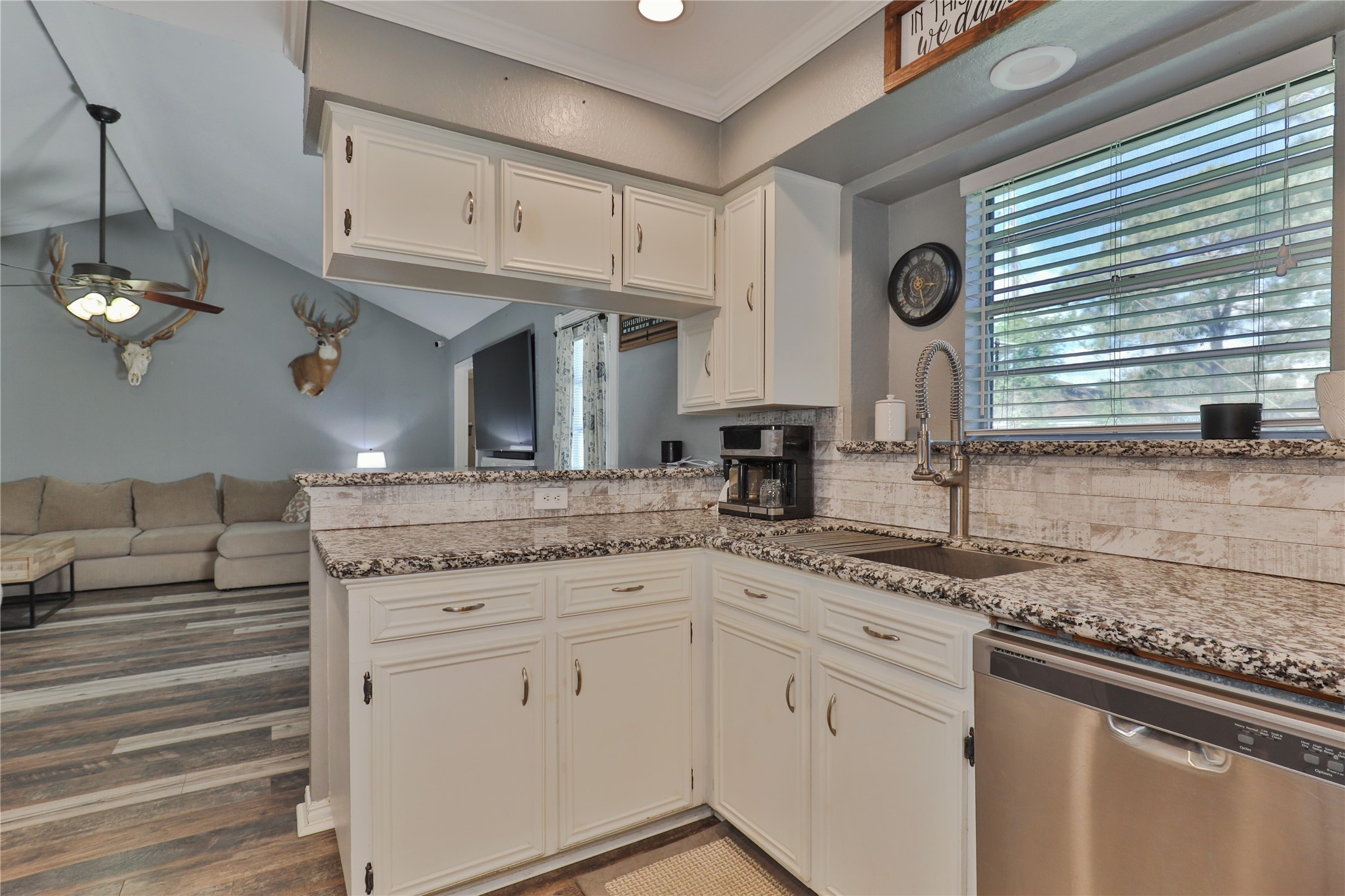 1 Shallowbrook Street Angleton, TX 77515 - Photo 11 of 30 a kitchen with granite countertop a sink stainless steel appliances and cabinets