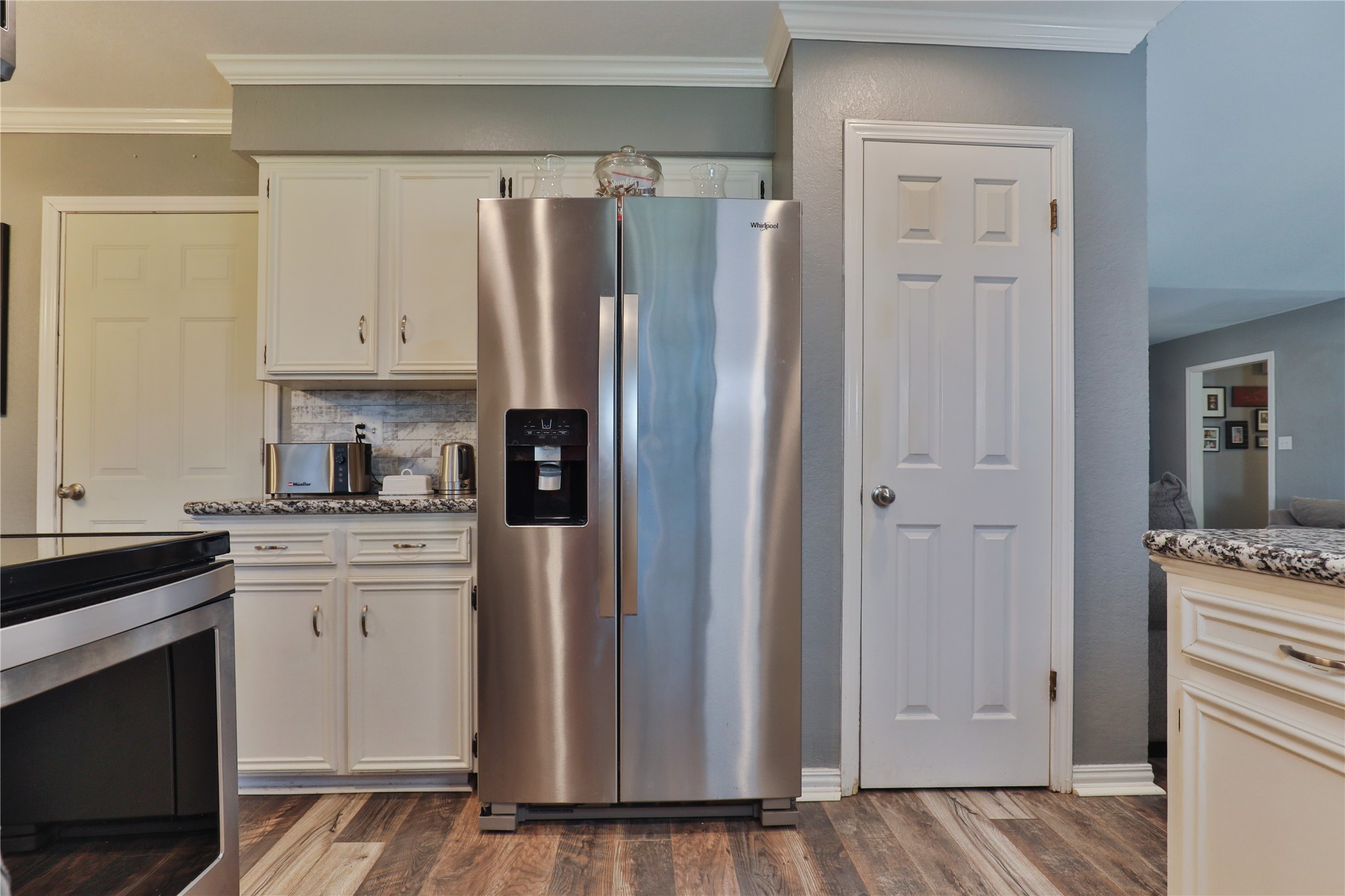 1 Shallowbrook Street Angleton, TX 77515 - Photo 12 of 30 a kitchen with stainless steel appliances granite countertop a refrigerator and a stove top oven