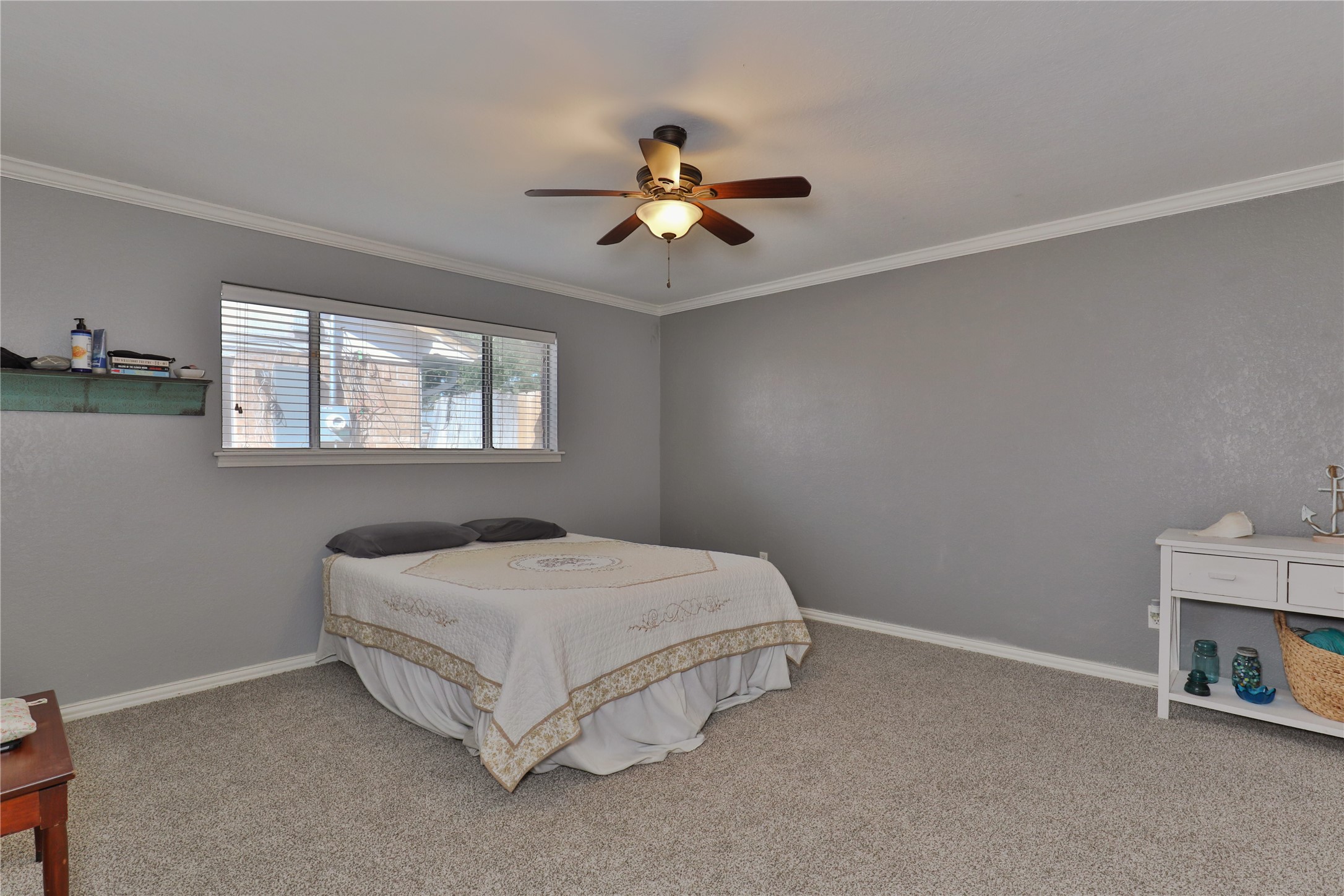 1 Shallowbrook Street Angleton, TX 77515 - Photo 14 of 30 a bedroom with a bed and window
