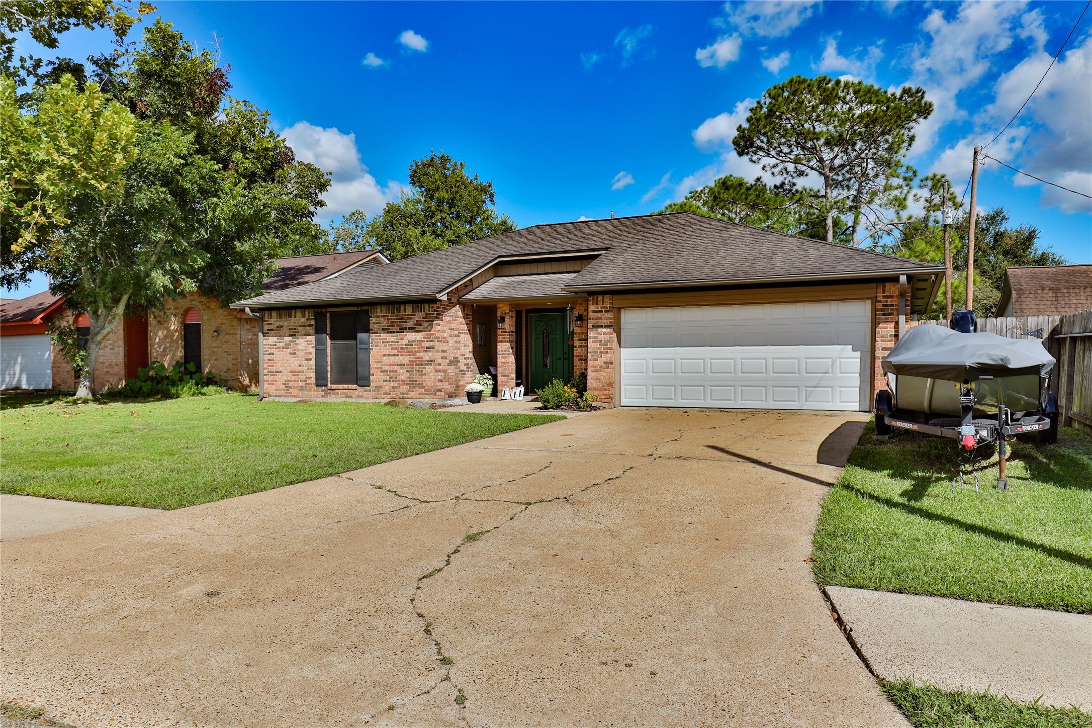 1 Shallowbrook Street Angleton, TX 77515 - Photo 2 of 30 a front view of a house with a yard and garage