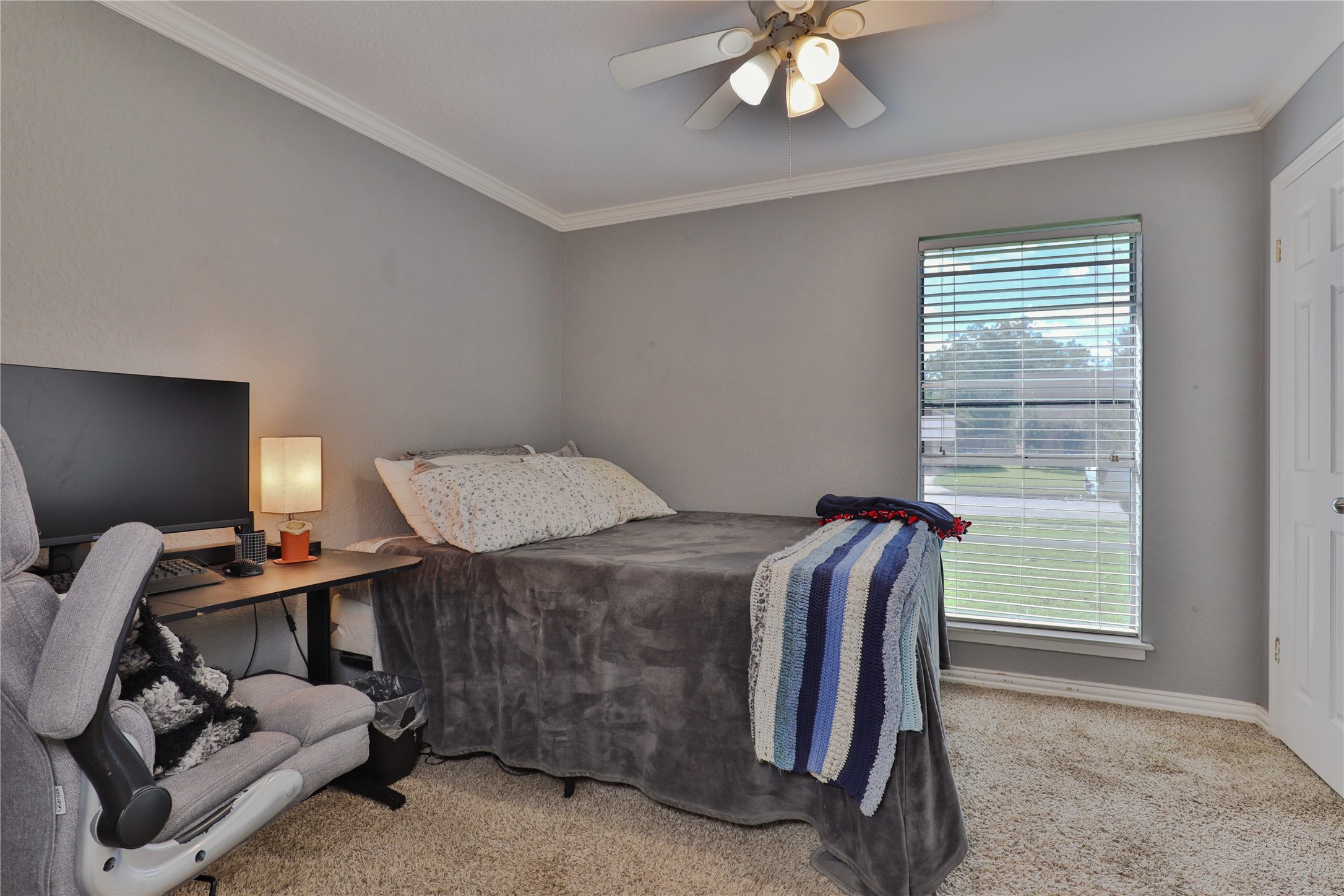 1 Shallowbrook Street Angleton, TX 77515 - Photo 23 of 30 a bedroom with a bed and a window