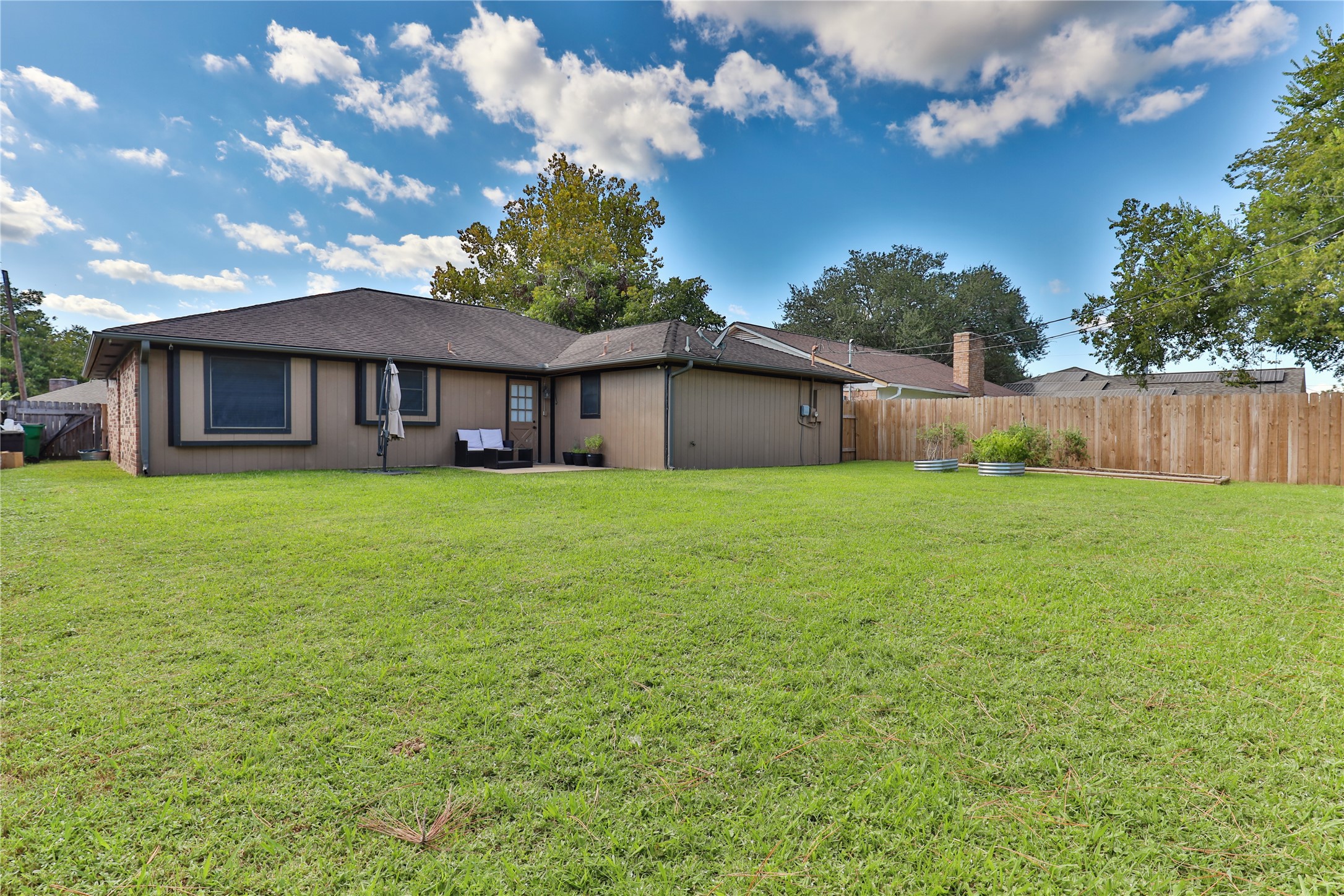 1 Shallowbrook Street Angleton, TX 77515 - Photo 30 of 30 a view of a house with a yard