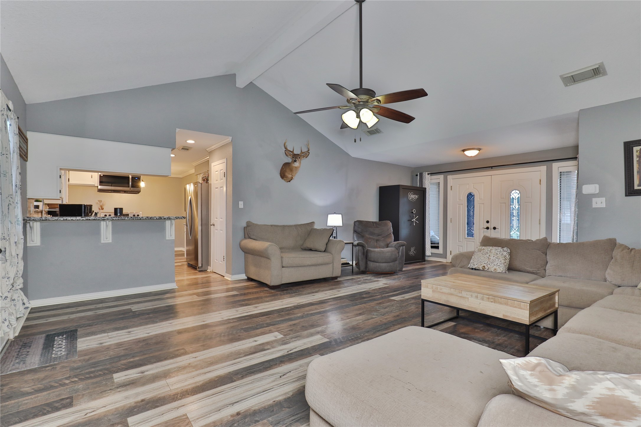 1 Shallowbrook Street Angleton, TX 77515 - Photo 8 of 30 a living room with furniture kitchen view and a chandelier