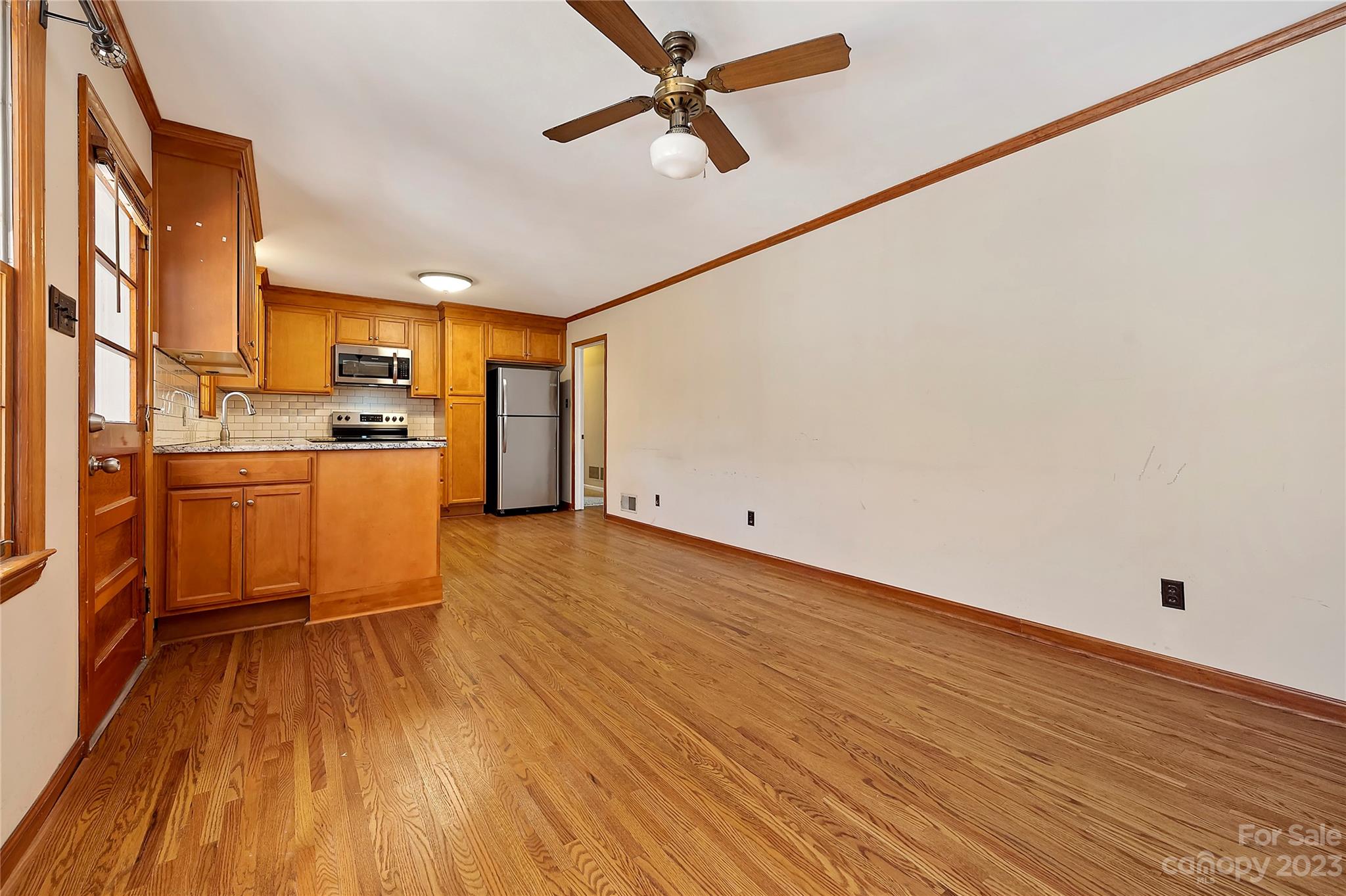 4200 Murrayhill Road Charlotte, NC 28209 - Photo 11 of 29 a kitchen with stainless steel appliances a stove top oven a sink and cabinets