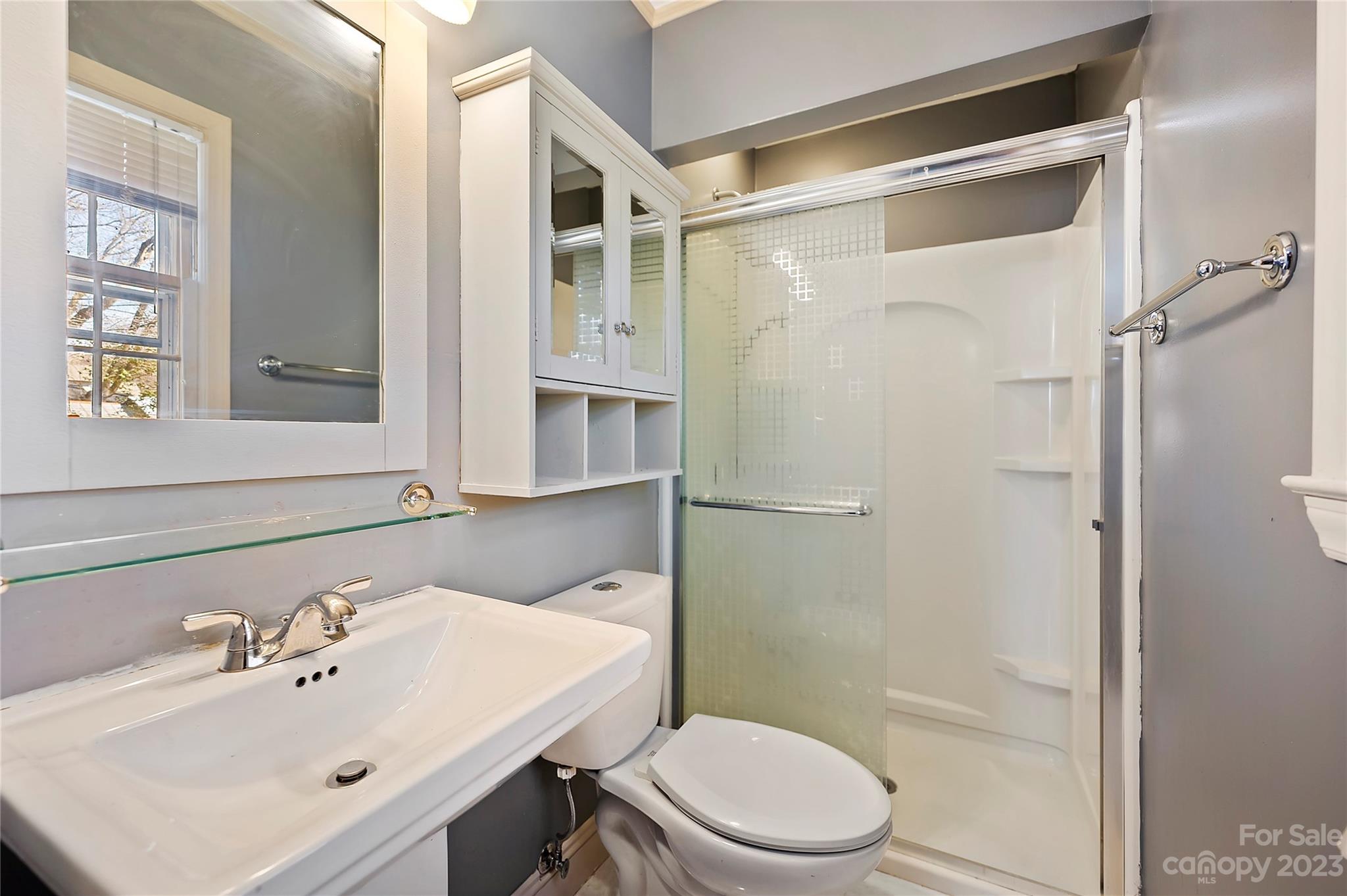 4200 Murrayhill Road Charlotte, NC 28209 - Photo 17 of 29 a bathroom with a sink mirror shower and toilet