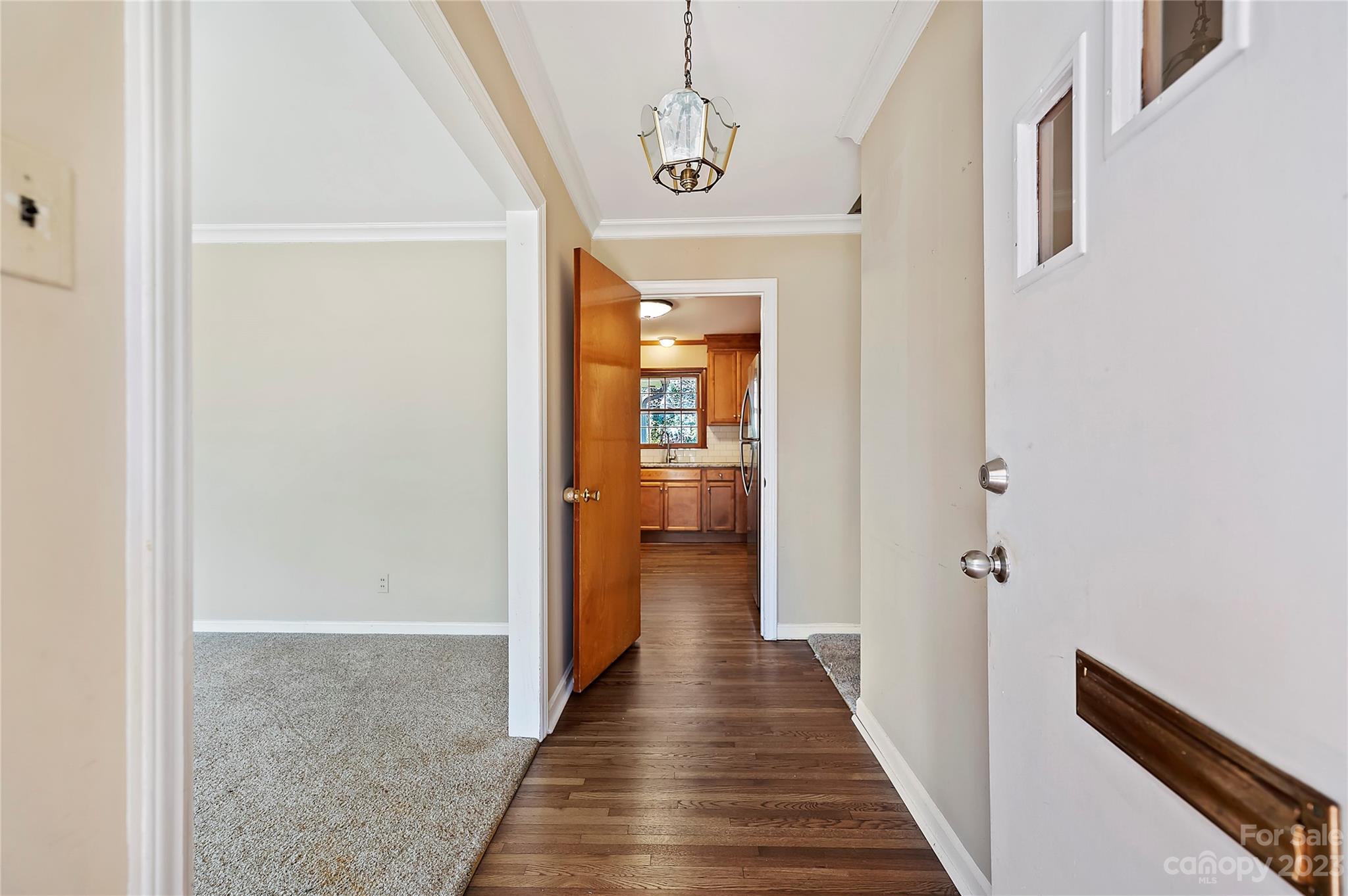 4200 Murrayhill Road Charlotte, NC 28209 - Photo 3 of 29 a view of a hallway with wooden floor and staircase