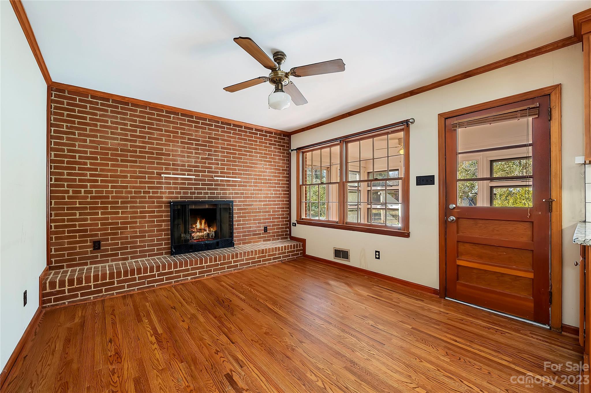 4200 Murrayhill Road Charlotte, NC 28209 - Photo 9 of 29 a view of an empty room with a fireplace and a window