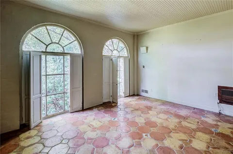 a view of empty room with windows