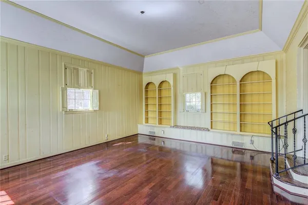 a view of an entryway with wooden floor