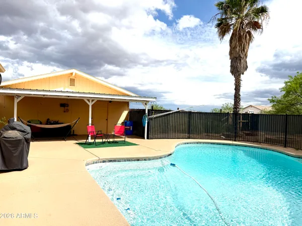a living room with fireplace furniture and a flat screen tv