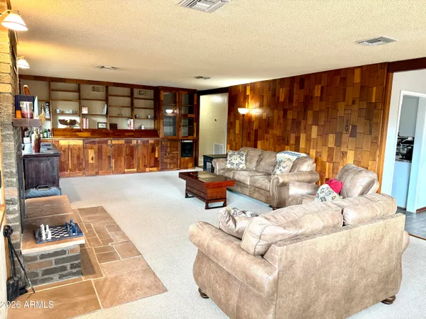 a kitchen with wooden floors and a sink