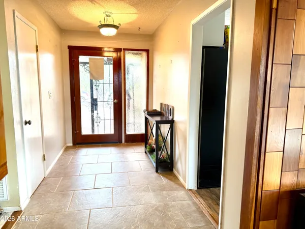 a kitchen with a sink a stove cabinets and wooden floor