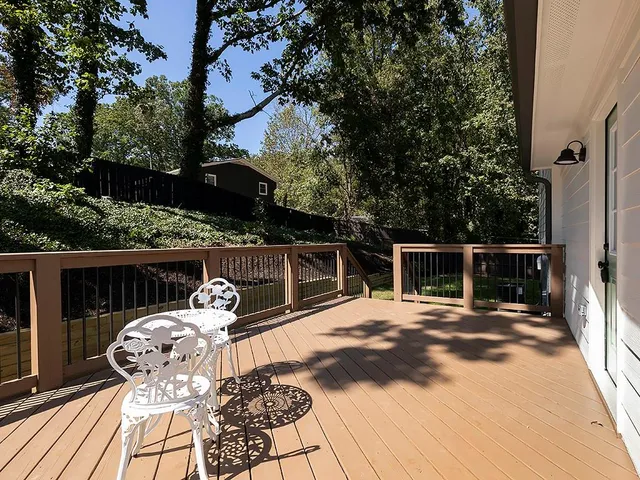 a view of a chairs and table on the wooden floor