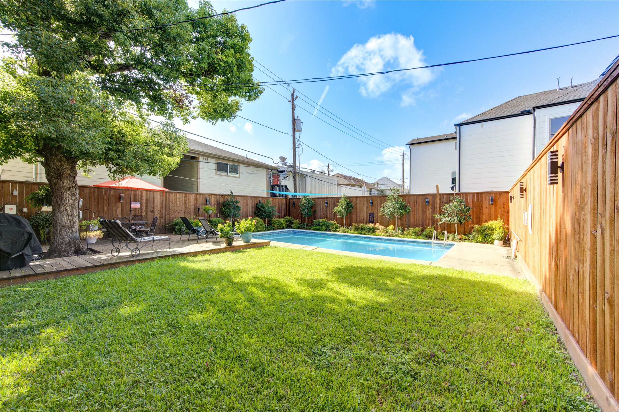 1909 Brun Street, Unit 16 Houston, TX 77019 - Photo 11 of 19 a view of a swimming pool with a patio and a yard