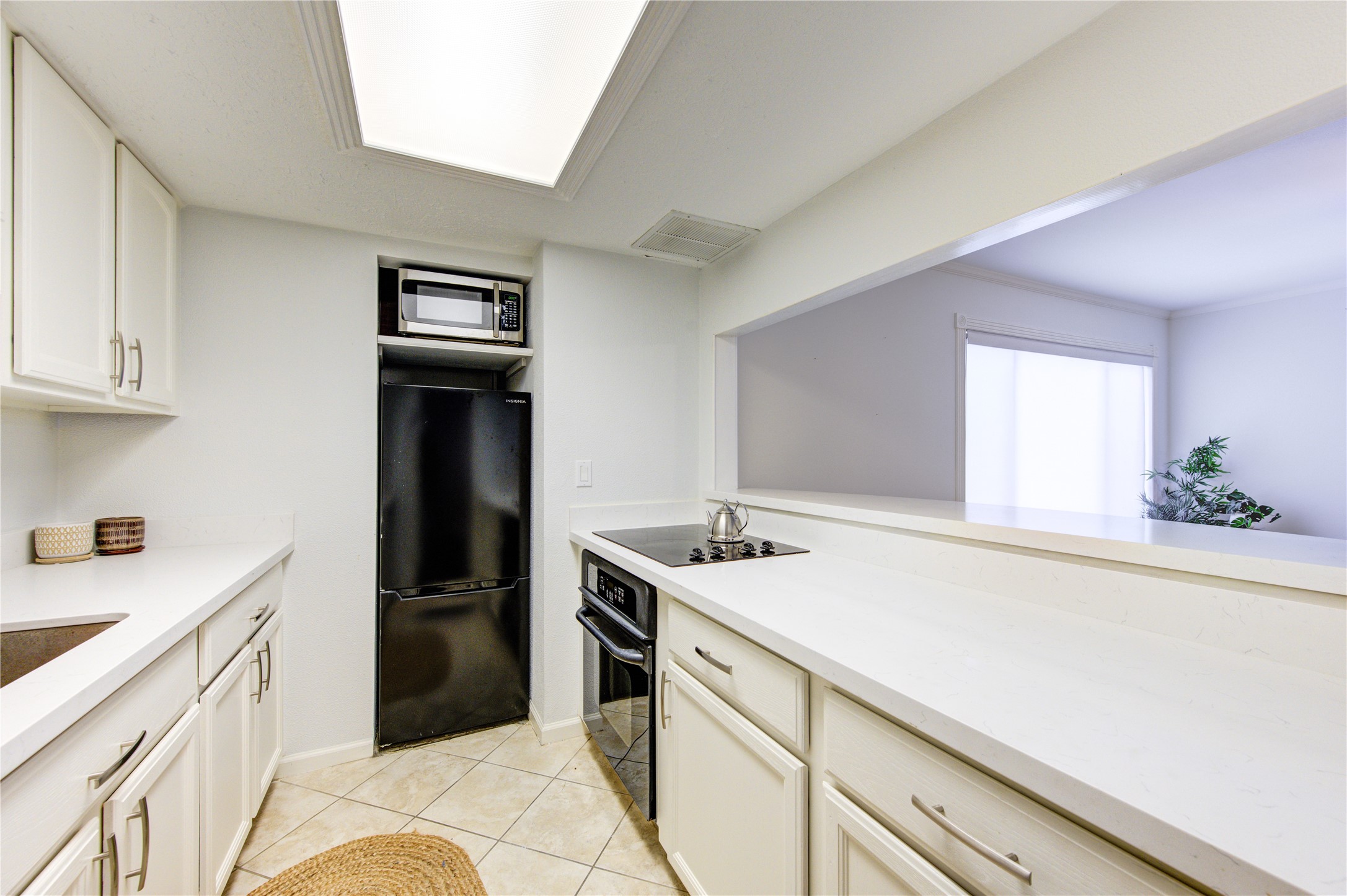 1909 Brun Street, Unit 16 Houston, TX 77019 - Photo 14 of 19 a kitchen with a sink appliances and cabinets