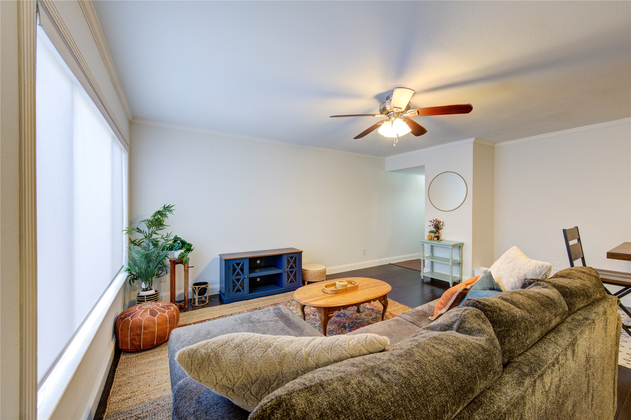 1909 Brun Street, Unit 16 Houston, TX 77019 - Photo 15 of 19 a bedroom with bed and a chandelier