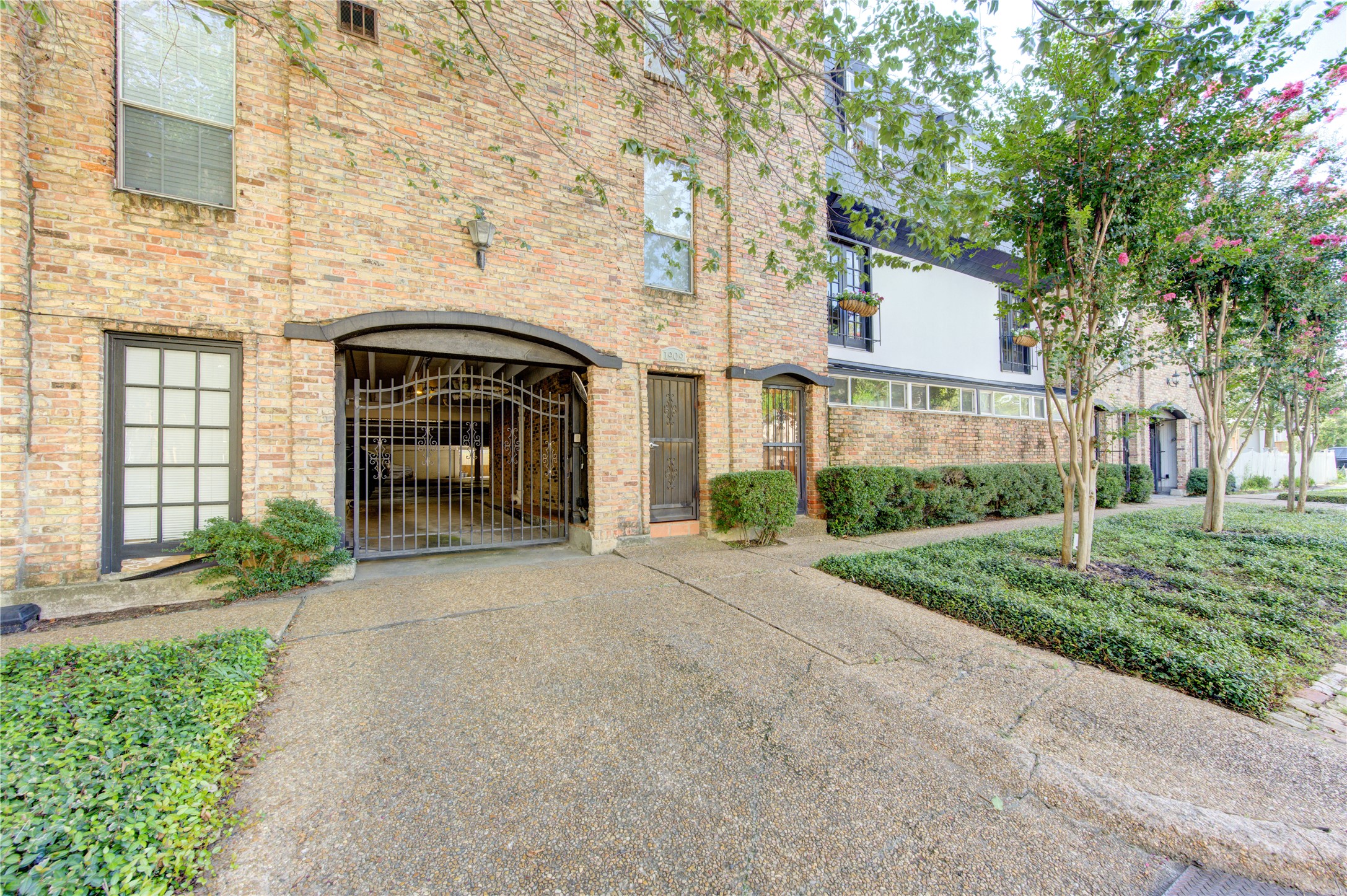 1909 Brun Street, Unit 16 Houston, TX 77019 - Photo 8 of 19 a front view of a house with garden