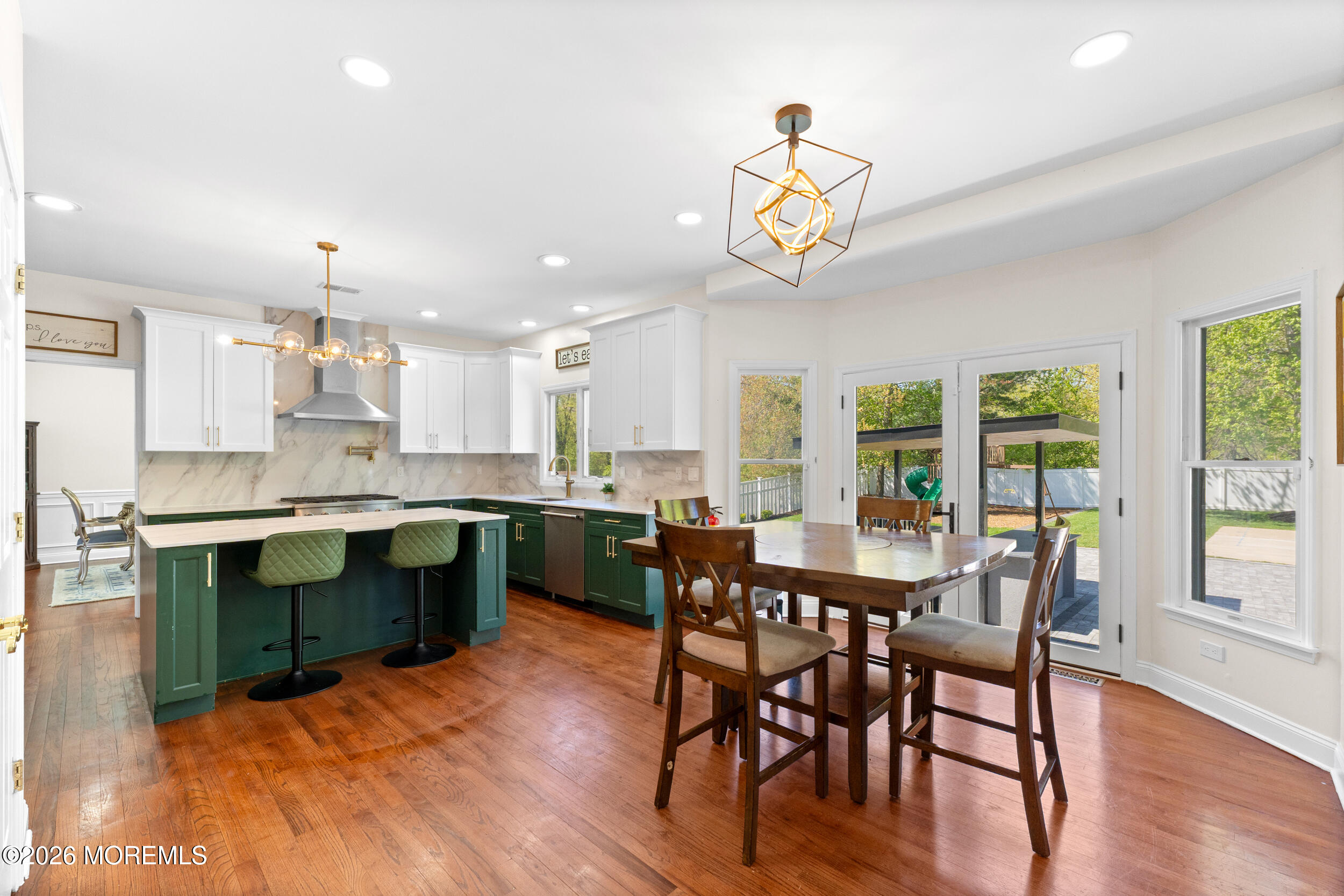 104 Autumn Road Matawan, NJ 07747 - Photo 17 of 64 a large kitchen with a table and chairs