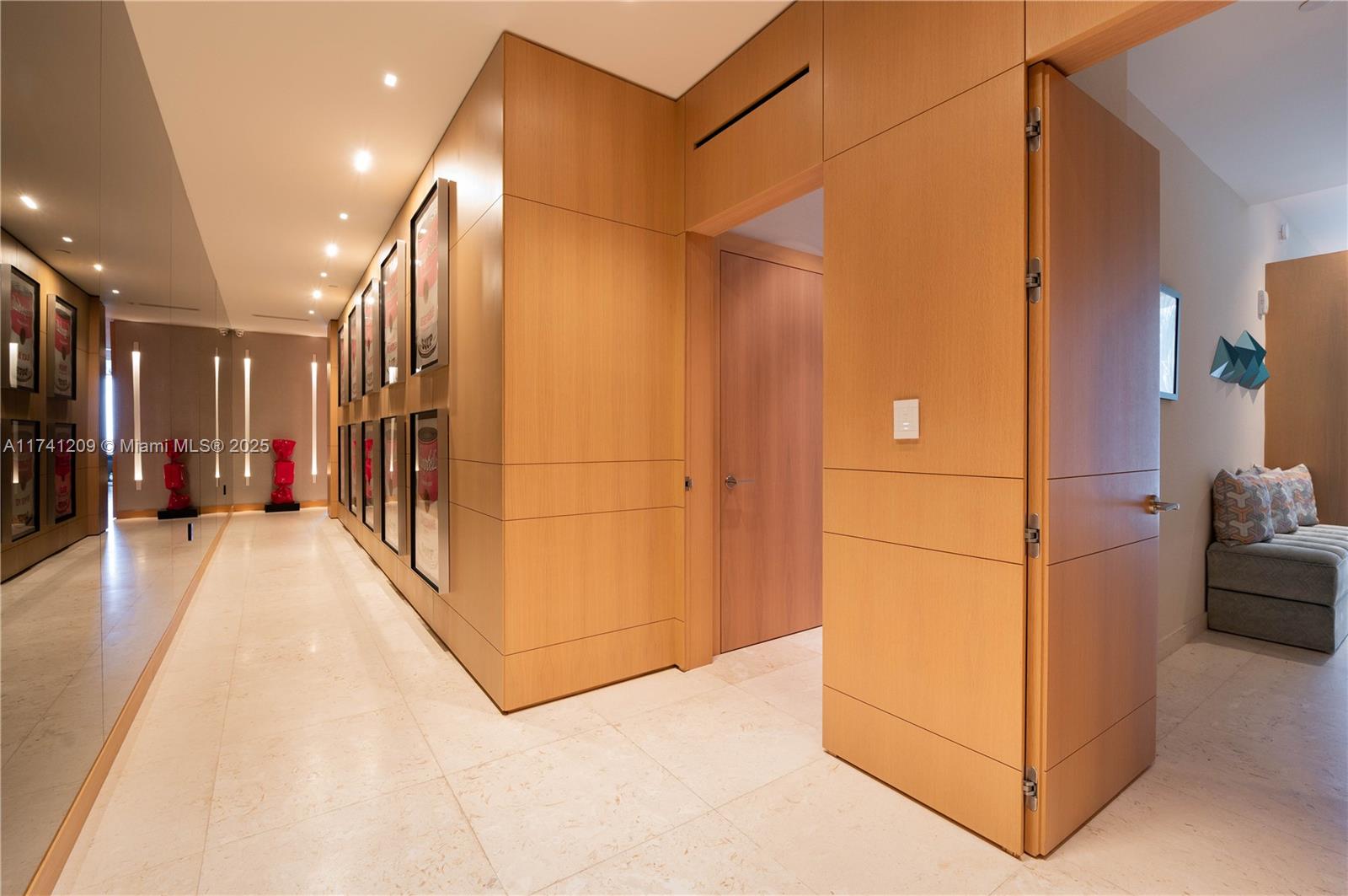 3581 East Glencoe Street, Unit 301 Miami, FL 33133 - Photo 11 of 21 a view of a hallway with stairs