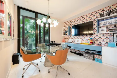 a living room with furniture fireplace and flat screen tv
