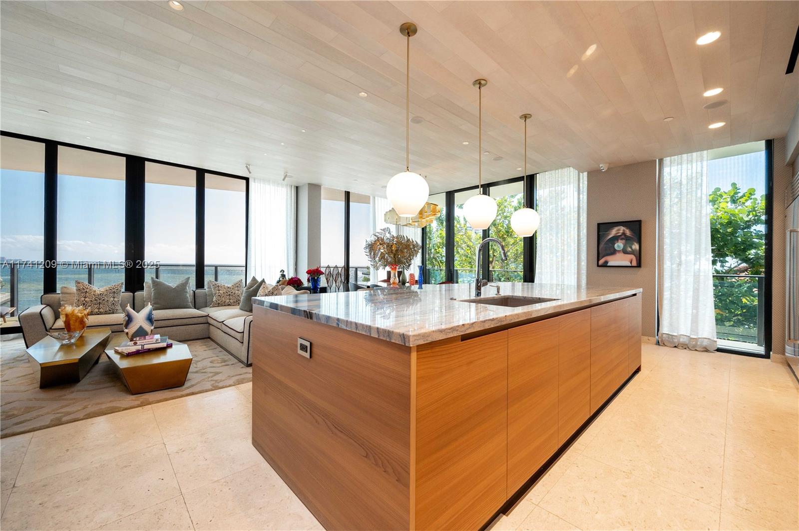 3581 East Glencoe Street, Unit 301 Miami, FL 33133 - Photo 5 of 21 a large living room with large windows