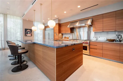 a kitchen with a sink cabinets and window