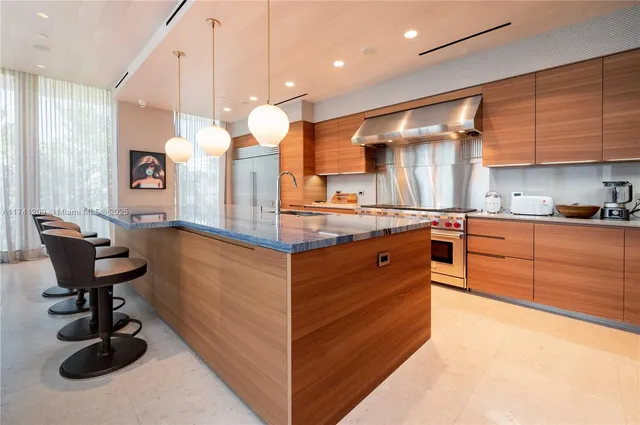 a kitchen with a sink cabinets and window