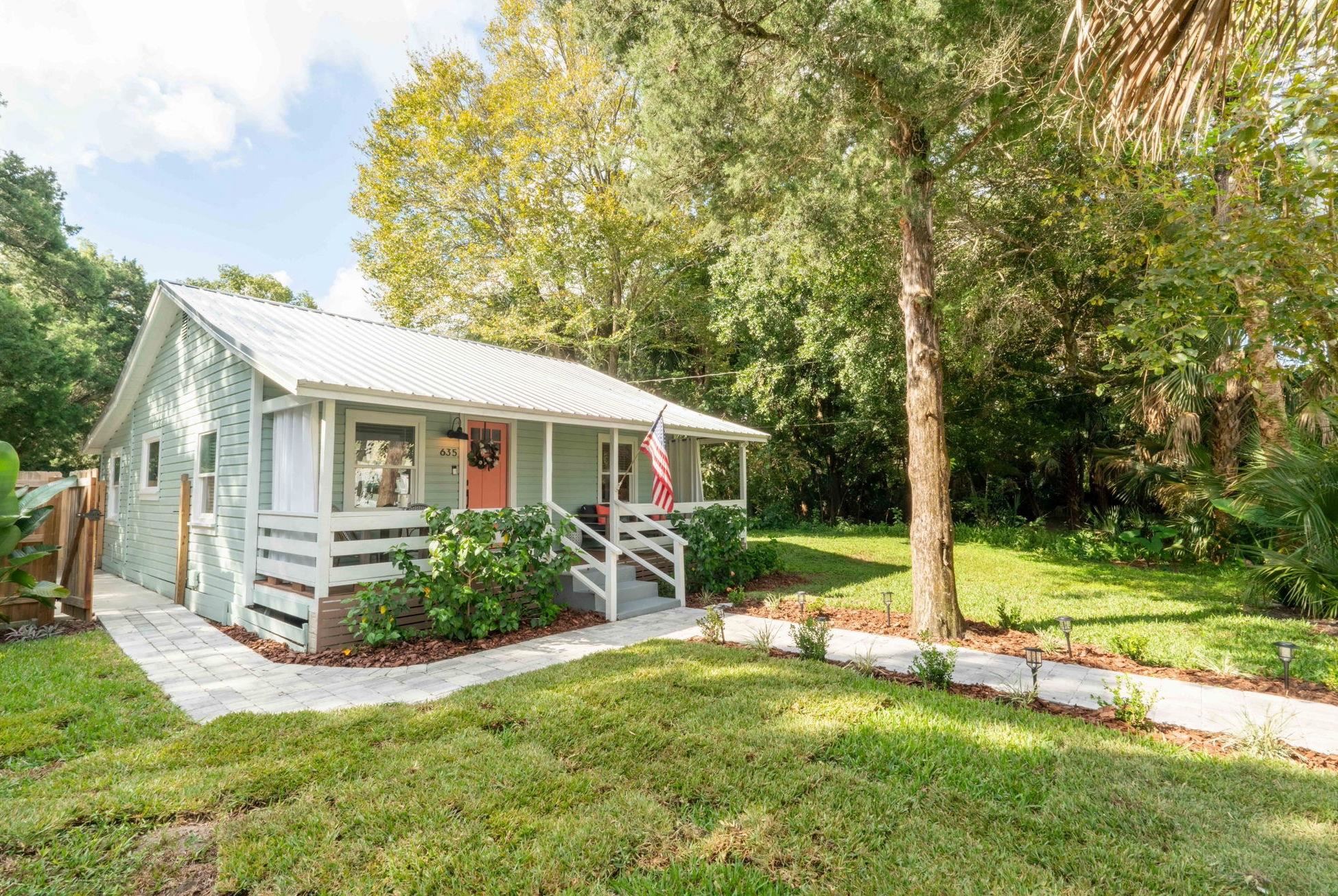635 Madeore Street St. Augustine, FL 32084 - Photo 1 of 44 a view of a house with backyard and a large tree