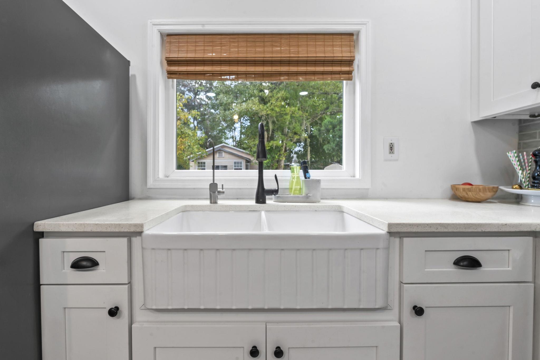 635 Madeore Street St. Augustine, FL 32084 - Photo 14 of 44 a kitchen with a sink and large window