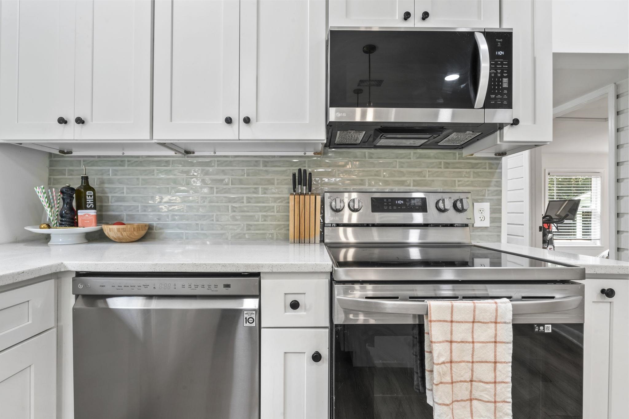 635 Madeore Street St. Augustine, FL 32084 - Photo 15 of 44 a kitchen with stainless steel appliances granite countertop a sink and a stove