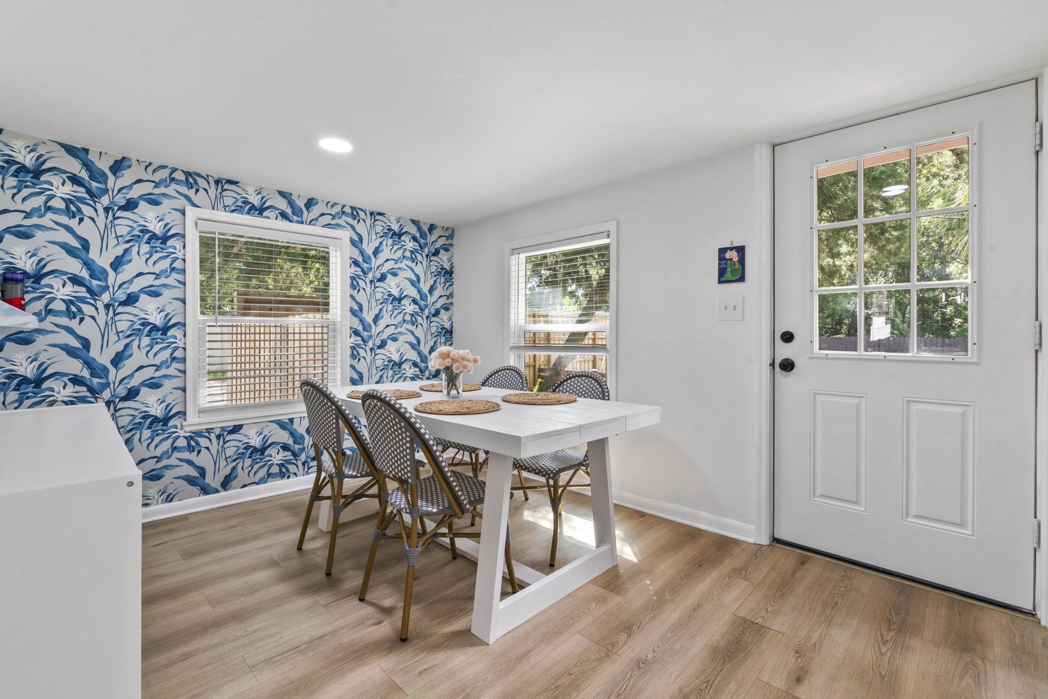 635 Madeore Street St. Augustine, FL 32084 - Photo 22 of 44 a view of a dining room with furniture and wooden floor