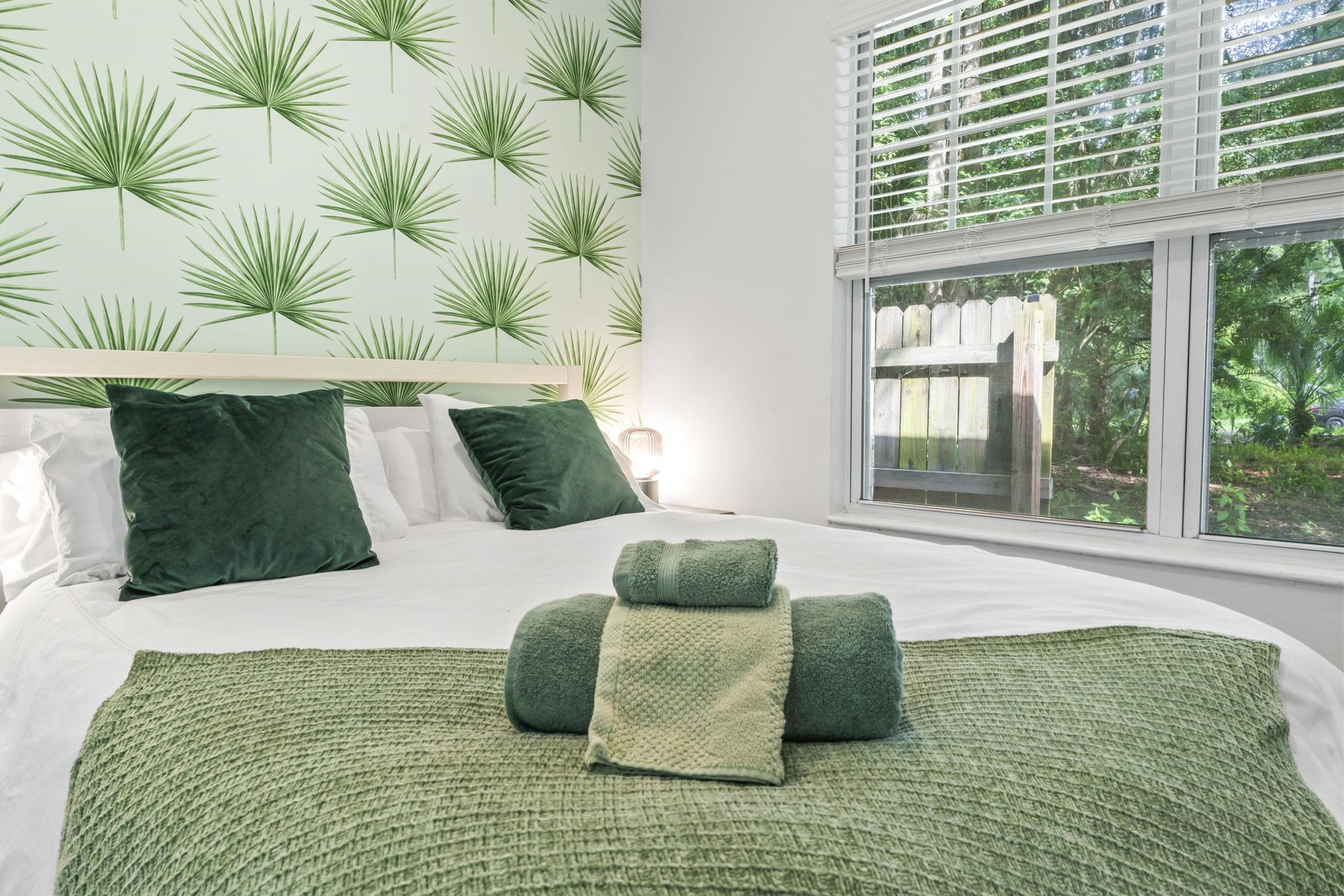 635 Madeore Street St. Augustine, FL 32084 - Photo 28 of 44 a bedroom with a bed lamp and a large window