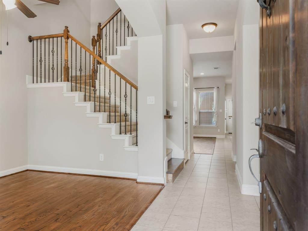 4672 Cecile Road Plano, TX 75024 - Photo 4 of 31 a view of a hallway with wooden floor and staircase