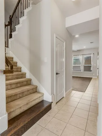 a view of entryway and hall with a window