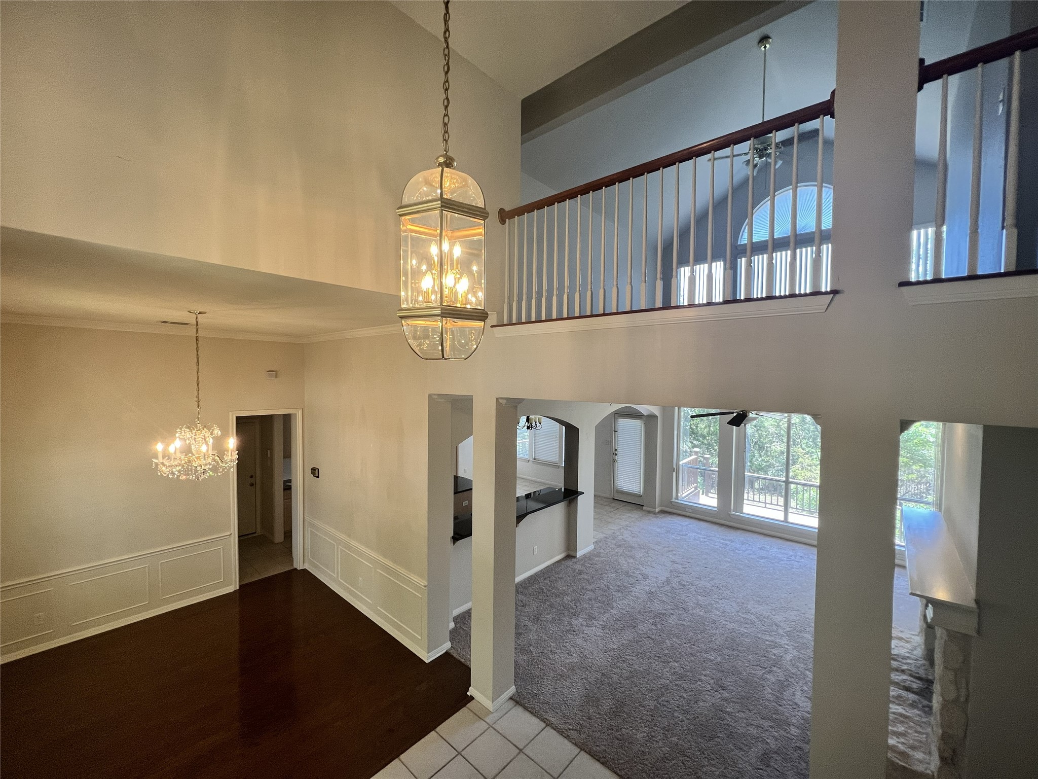 9405 Ashton Ridge Austin, TX 78750 - Photo 13 of 22 A grand two-story entry welcomes you, showcasing a formal dining space and a sun-filled living area.