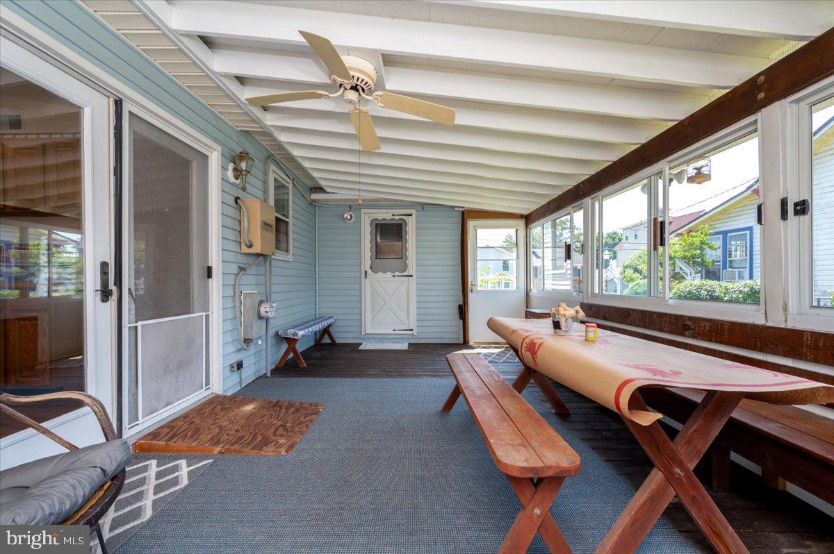 8236 Bayside Road Chesapeake Beach, MD 20732 - Photo 10 of 39 a living room with furniture and a floor to ceiling window
