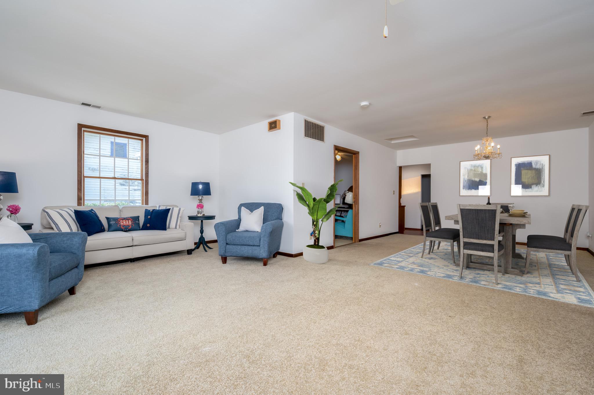 8236 Bayside Road Chesapeake Beach, MD 20732 - Photo 11 of 39 a living room with furniture and a table