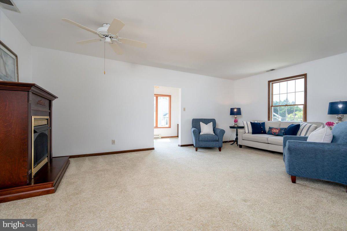 8236 Bayside Road Chesapeake Beach, MD 20732 - Photo 14 of 39 a living room with furniture and a window