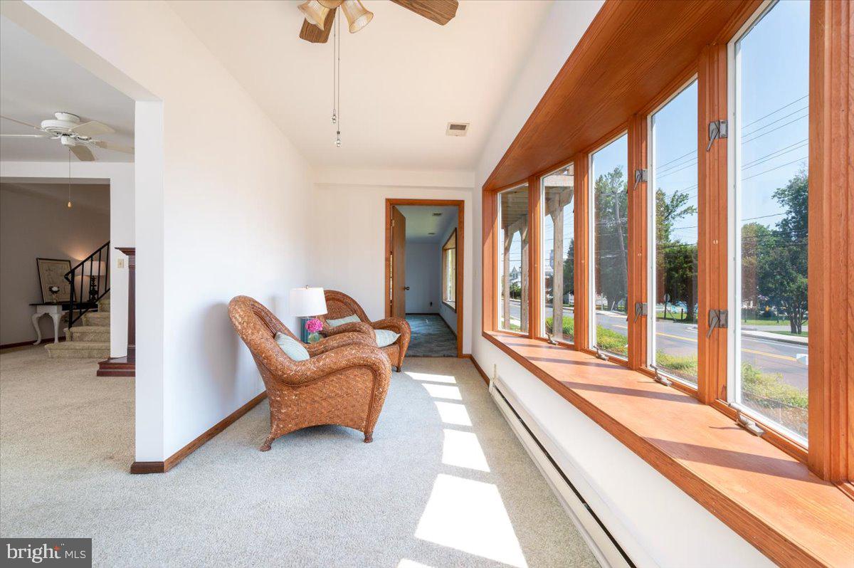 8236 Bayside Road Chesapeake Beach, MD 20732 - Photo 15 of 39 a living room with furniture and a large window